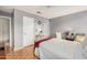 Neutral toned main bedroom with wood floors, ceiling fan, and a large closet at 1973 E Buena Vista Dr, Chandler, AZ 85249