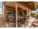 Relaxing covered patio featuring tile flooring, ceiling fans and outdoor furniture at 1973 E Buena Vista Dr, Chandler, AZ 85249