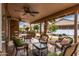 Inviting covered patio with comfortable seating and ceiling fans for relaxing outdoors at 1973 E Buena Vista Dr, Chandler, AZ 85249