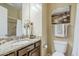 Stylish bathroom features a granite countertop, decorative accents and shower and tub combination at 20187 E Sonoqui Blvd, Queen Creek, AZ 85142