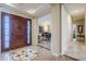 Stunning foyer with tile flooring, a decorative inlay, and views into the formal living space at 20187 E Sonoqui Blvd, Queen Creek, AZ 85142