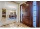 Elegant foyer with a view into the dining room, showcasing a chandelier and dining set at 20187 E Sonoqui Blvd, Queen Creek, AZ 85142