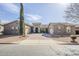 Beautiful front exterior view with a circular driveway and stone accents, offering great curb appeal at 20187 E Sonoqui Blvd, Queen Creek, AZ 85142