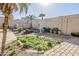 Lush garden area with a charming fountain, creating a peaceful and inviting outdoor space at 20187 E Sonoqui Blvd, Queen Creek, AZ 85142