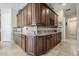 Spacious corner of kitchen with custom cabinets and granite countertops with decorative tile backsplash at 20187 E Sonoqui Blvd, Queen Creek, AZ 85142