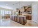 Gourmet kitchen featuring large island, pendant lighting, and stainless steel appliances at 20187 E Sonoqui Blvd, Queen Creek, AZ 85142