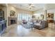 Inviting living room with stone fireplace, natural light, and comfortable seating area at 20187 E Sonoqui Blvd, Queen Creek, AZ 85142