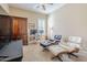 Bright living room with modern furniture, a ceiling fan, and plenty of space to unwind at 20187 E Sonoqui Blvd, Queen Creek, AZ 85142