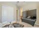 View of the living room with access to the ensuite bathroom and ample closet space at 20187 E Sonoqui Blvd, Queen Creek, AZ 85142