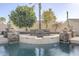 Tranquil pool with stylish stone water features creates a serene backyard atmosphere at 20187 E Sonoqui Blvd, Queen Creek, AZ 85142