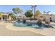 Inviting backyard pool with stone accents and lush landscaping offers a private outdoor oasis at 20187 E Sonoqui Blvd, Queen Creek, AZ 85142