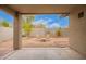 Backyard with gravel, two chairs and string lights at 2021 S 84Th Ave, Tolleson, AZ 85353