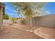 Landscaped backyard showcasing rock features, stepping stones, and block wall, providing an outdoor living space at 2021 S 84Th Ave, Tolleson, AZ 85353