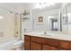 Bathroom featuring a shower-tub combo and dark wood vanity with a white sink at 2021 S 84Th Ave, Tolleson, AZ 85353