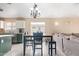 Dining area connected to the kitchen, featuring modern decor and plenty of natural light at 2021 S 84Th Ave, Tolleson, AZ 85353