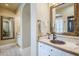 Bathroom featuring a large mirror and sink with copper basin at 20704 N 90Th Pl # 1065, Scottsdale, AZ 85255