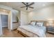 Bedroom with stairs, hardwood floors, ceiling fan, and built-in storage at 20704 N 90Th Pl # 1065, Scottsdale, AZ 85255