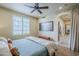 Bedroom with hardwood floors, large window, ensuite bathroom and ceiling fan at 20704 N 90Th Pl # 1065, Scottsdale, AZ 85255