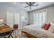 Bedroom with modern furniture, light gray walls, and natural light from the window at 20704 N 90Th Pl # 1065, Scottsdale, AZ 85255