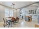 Elegant dining room with modern chandelier and an open view to the kitchen at 20704 N 90Th Pl # 1065, Scottsdale, AZ 85255