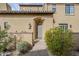 Inviting front entrance with a covered porch and desert shrubs at 20704 N 90Th Pl # 1065, Scottsdale, AZ 85255