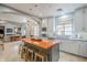 Kitchen featuring gray cabinets and an island with a vibrant orange countertop at 20704 N 90Th Pl # 1065, Scottsdale, AZ 85255