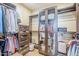 Spacious walk-in closet with custom storage solutions at 20704 N 90Th Pl # 1065, Scottsdale, AZ 85255