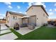 Inviting backyard patio features a modern fire pit, comfortable seating, and well manicured artificial turf at 20954 E Camacho Ct, Queen Creek, AZ 85142