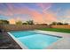 Lush backyard with a sparkling pool offers a tranquil escape and picturesque views under a vibrant sky at 20954 E Camacho Ct, Queen Creek, AZ 85142