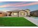 Well-maintained backyard features a pool and spacious lawn, perfect for outdoor gatherings and relaxation at 20954 E Camacho Ct, Queen Creek, AZ 85142