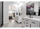 Elegant bathroom features double sinks, modern fixtures, and glass-enclosed shower at 20954 E Camacho Ct, Queen Creek, AZ 85142