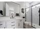 Well-lit bathroom with bright white vanity, black hardware, and walk-in shower at 20954 E Camacho Ct, Queen Creek, AZ 85142