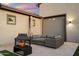 Inviting outdoor patio with a cozy fireplace and comfortable seating, ideal for relaxing and entertaining guests at 20954 E Camacho Ct, Queen Creek, AZ 85142