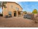 Backyard featuring a covered patio, rock landscaping and a hot tub at 21629 N Dietz Dr, Maricopa, AZ 85138