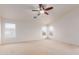 Bedroom featuring neutral walls, carpet, ceiling fan and plenty of natural light at 21629 N Dietz Dr, Maricopa, AZ 85138