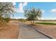 Golf course fairway featuring desert landscaping and neighborhood homes in background at 21629 N Dietz Dr, Maricopa, AZ 85138