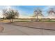 View of the community golf course featuring sand traps and desert landscaping at 21629 N Dietz Dr, Maricopa, AZ 85138