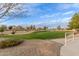 Community green space with lush landscaping and walking paths at 21629 N Dietz Dr, Maricopa, AZ 85138