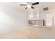 Spacious loft area with ceiling fan and decorative railing, perfect for relaxing at 21629 N Dietz Dr, Maricopa, AZ 85138