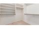 Walk-in closet with shelving for optimal storage and organization at 21629 N Dietz Dr, Maricopa, AZ 85138