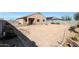 Spacious backyard with a mix of desert landscaping and ample room for outdoor activities at 21889 N 259Th Ave, Buckeye, AZ 85396