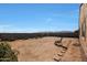 Full backyard view with lush plant border and ample space for relaxation or entertainment at 21889 N 259Th Ave, Buckeye, AZ 85396