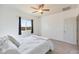 Cozy bedroom featuring neutral tones, ceiling fan and a window providing ample natural light at 21889 N 259Th Ave, Buckeye, AZ 85396