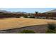 Beautiful community lawn with walking path, park bench, and mountain views at 21889 N 259Th Ave, Buckeye, AZ 85396