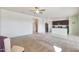 An open-concept living room with carpet flooring leading to a modern kitchen featuring granite countertops at 21889 N 259Th Ave, Buckeye, AZ 85396