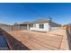 Home's backyard features a door, covered patio, fresh landscape, new fence, waiting to become the new owner's dream at 2227 W Cambridge Ave, Phoenix, AZ 85009