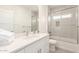 Well-lit bathroom with a modern vanity, shower and tub combination at 2227 W Cambridge Ave, Phoenix, AZ 85009