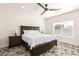 A bedroom with a ceiling fan, window, and geometric tile flooring at 2227 W Cambridge Ave, Phoenix, AZ 85009