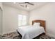 Cozy bedroom with a wood-finished headboard and geometric-patterned flooring at 2227 W Cambridge Ave, Phoenix, AZ 85009