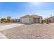 Single-Gathering home with a wide driveway and xeriscaped front yard at 2227 W Cambridge Ave, Phoenix, AZ 85009